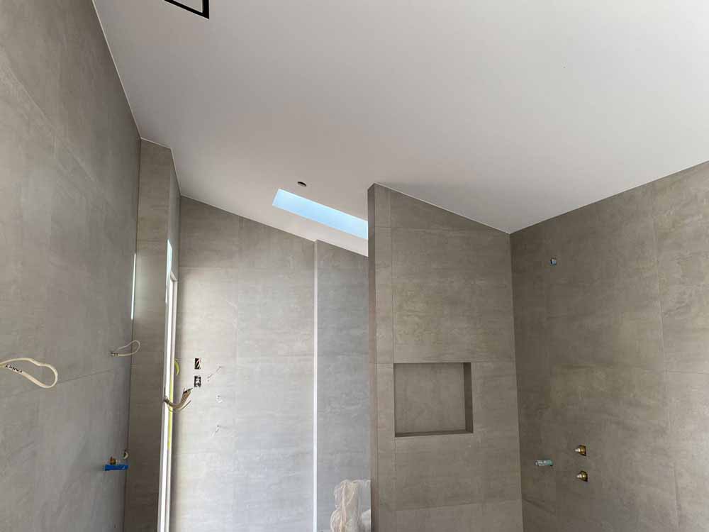 Bathroom interior with tiled walls and moisture resistant surfaces